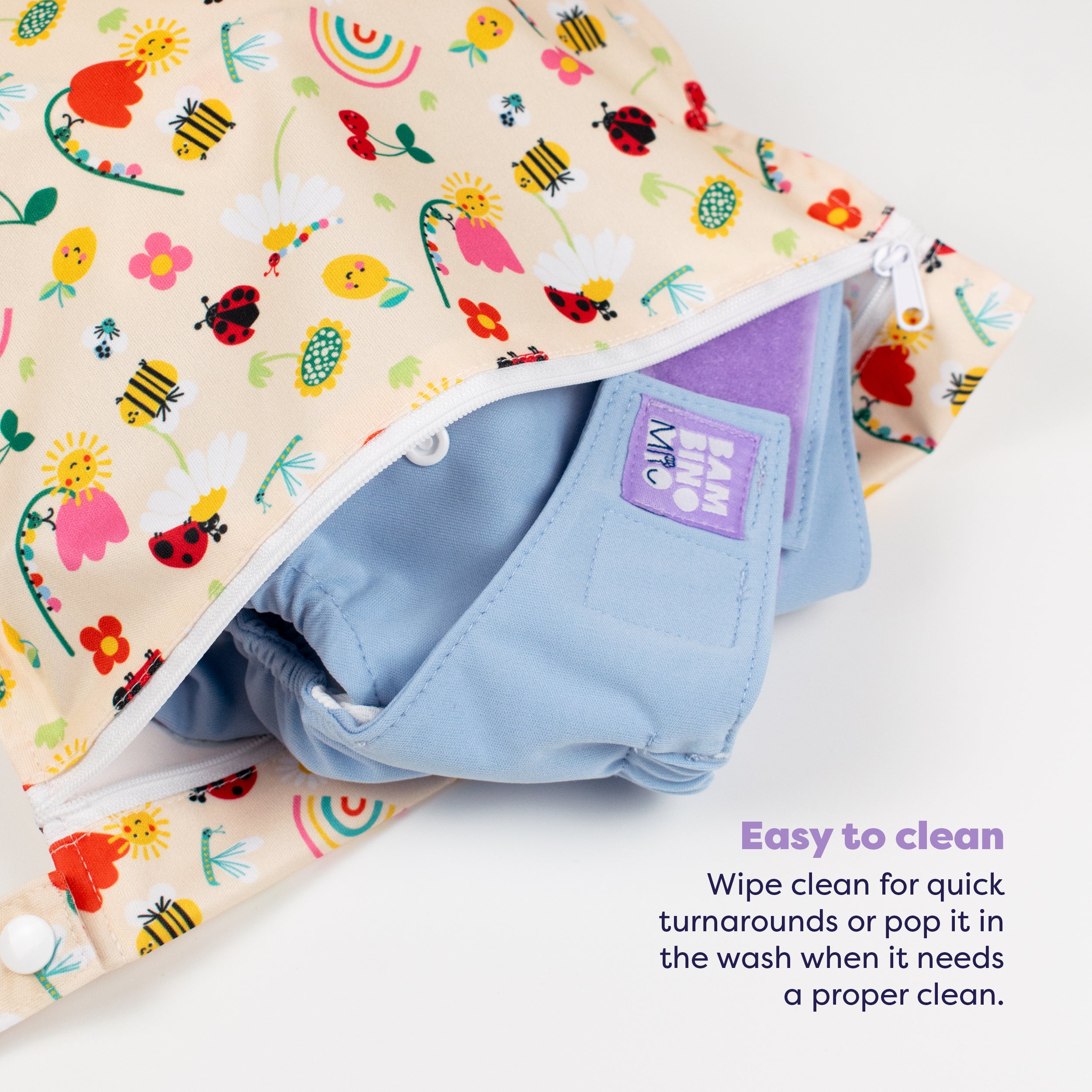 Out and About Waterproof Wet Nappy Bag in Sunshine Friends - Bambino Mio (UK)