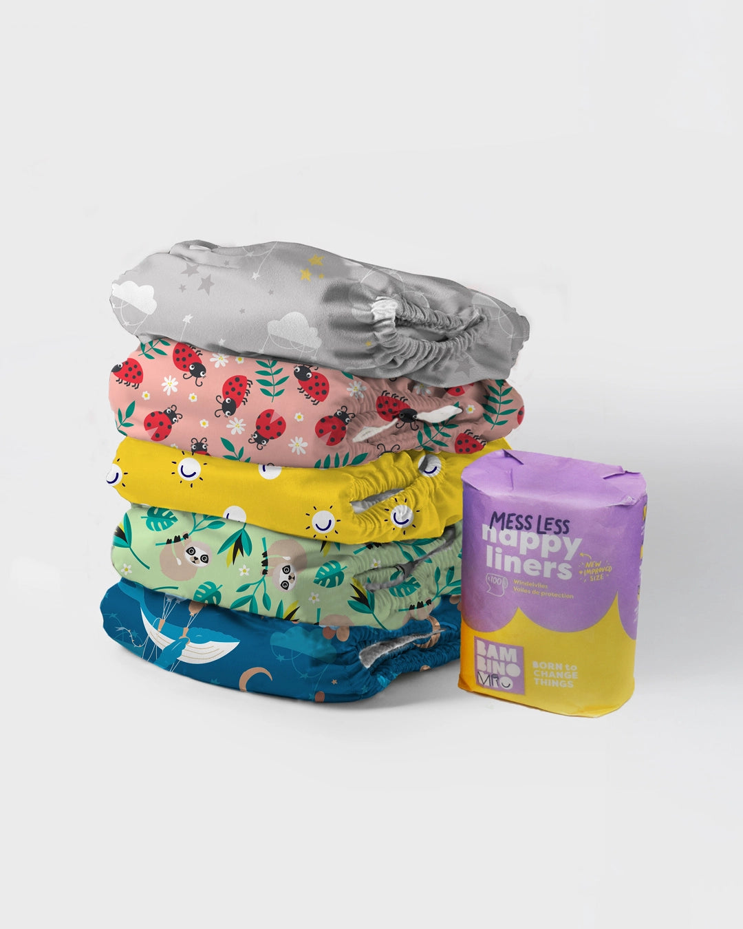 5 diapers featuring fun colourful prints such as red ladybirds, yellow smiles, green sloths. And a pack of messless nappy liners
